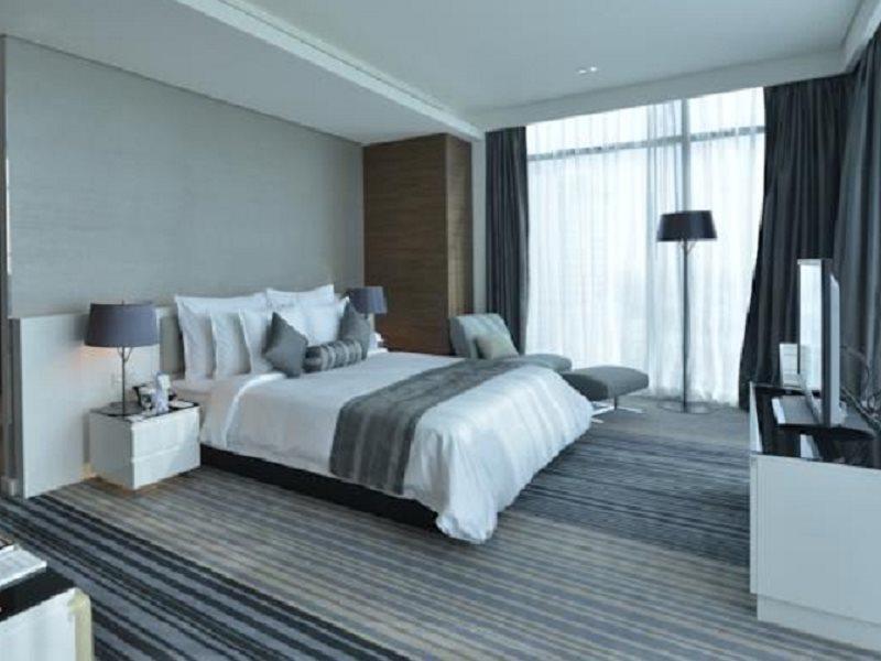 Ramee Grand Hotel And Spa Μανάμα Εξωτερικό φωτογραφία A bedroom at the hotel